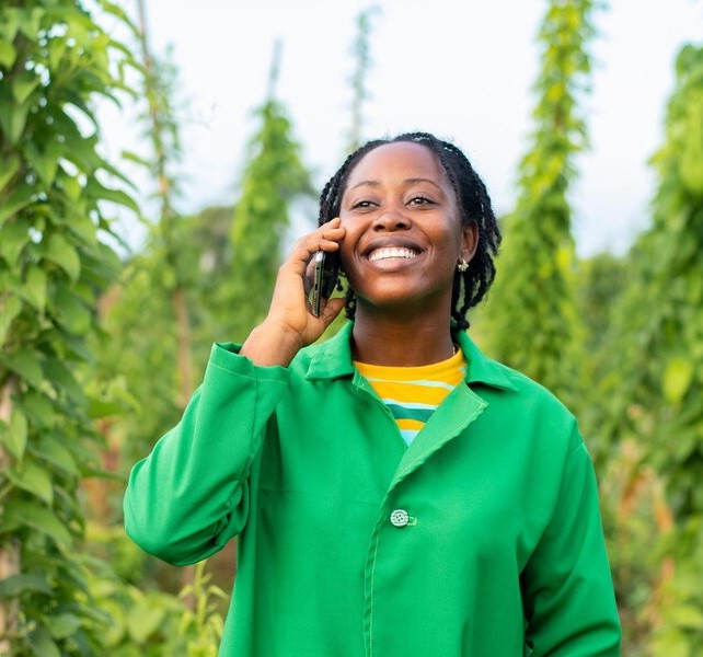 cheerful-african-farmer-talking-on-phone